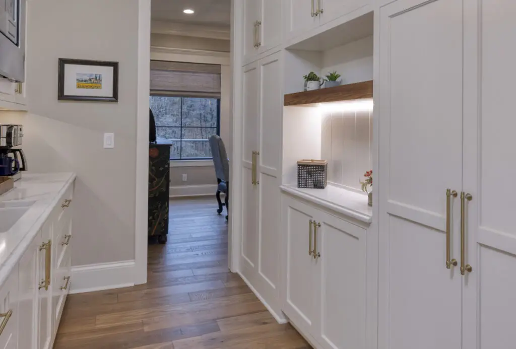 white cabinets with gold handles in home kitchen